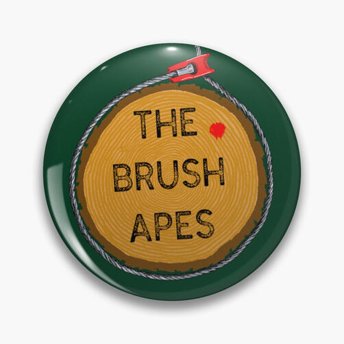 The Brush Apes logo with a green background on a pinback button.